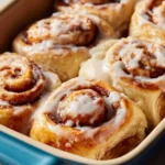 Delicious banana bread cinnamon rolls topped with icing and cinnamon