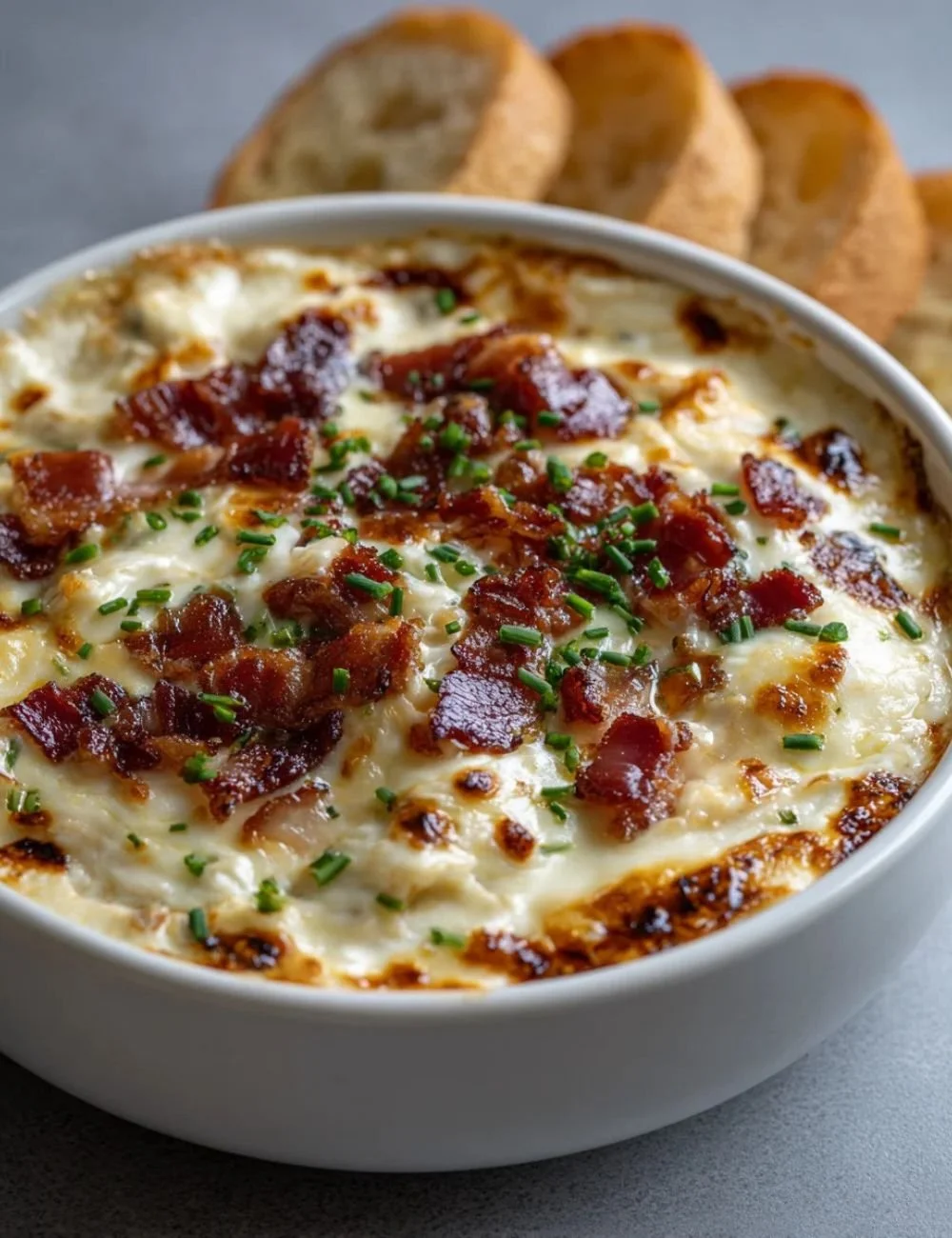 Creamy Gouda Beef Bacon Dip served in a bowl with crackers