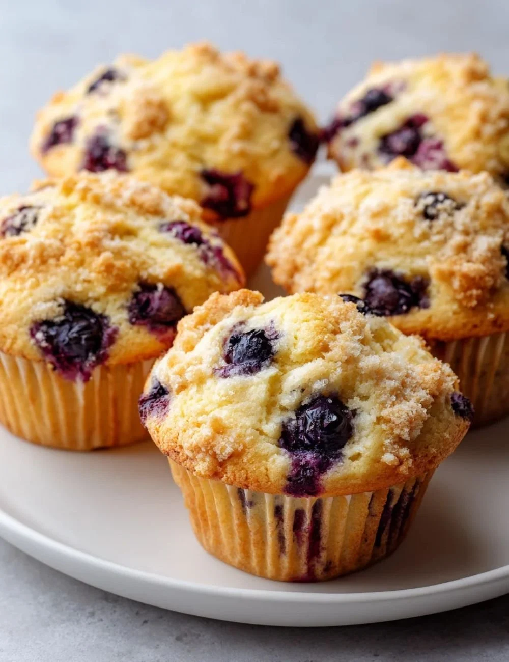 Freshly baked homemade blueberry protein muffins on a wooden table