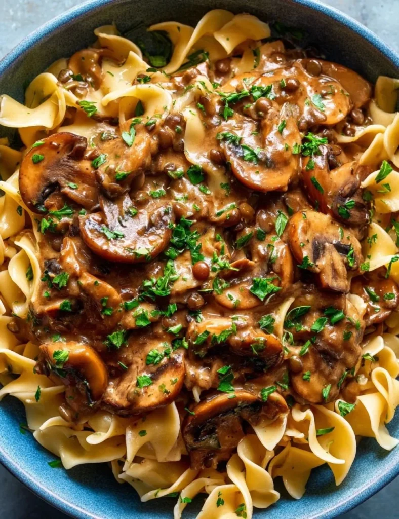 Delicious Lentil Mushroom Stroganoff served in a bowl garnished with herbs