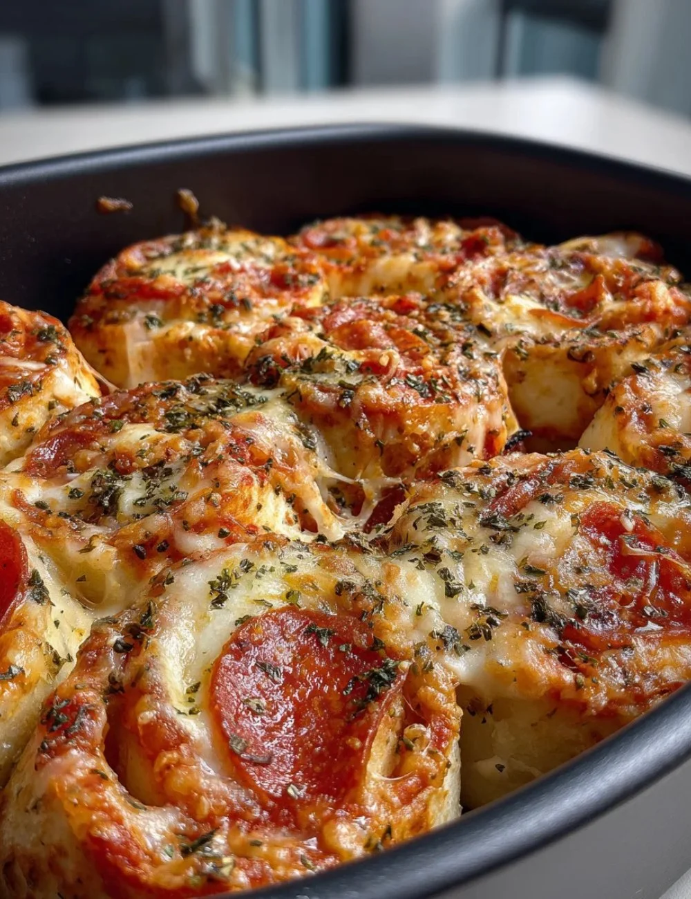 Delicious and cheesy Pizza Roll Ups served on a plate.