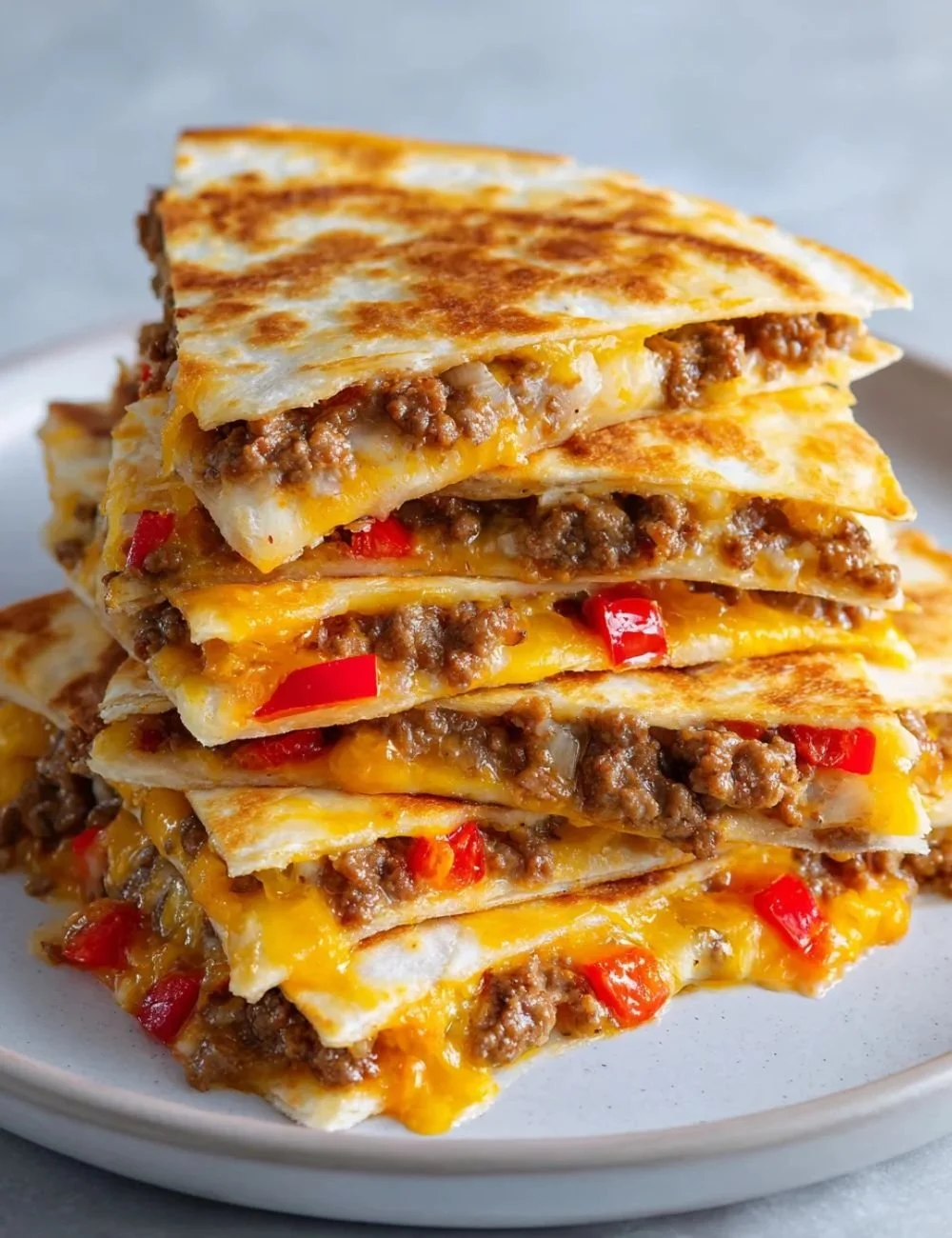 Sheet Pan Quesadilla with melted cheese and colorful veggies