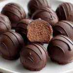 Deliciously rich chickpea chocolate truffles topped with cocoa powder.