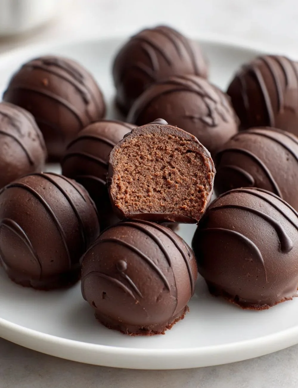 Deliciously rich chickpea chocolate truffles topped with cocoa powder.