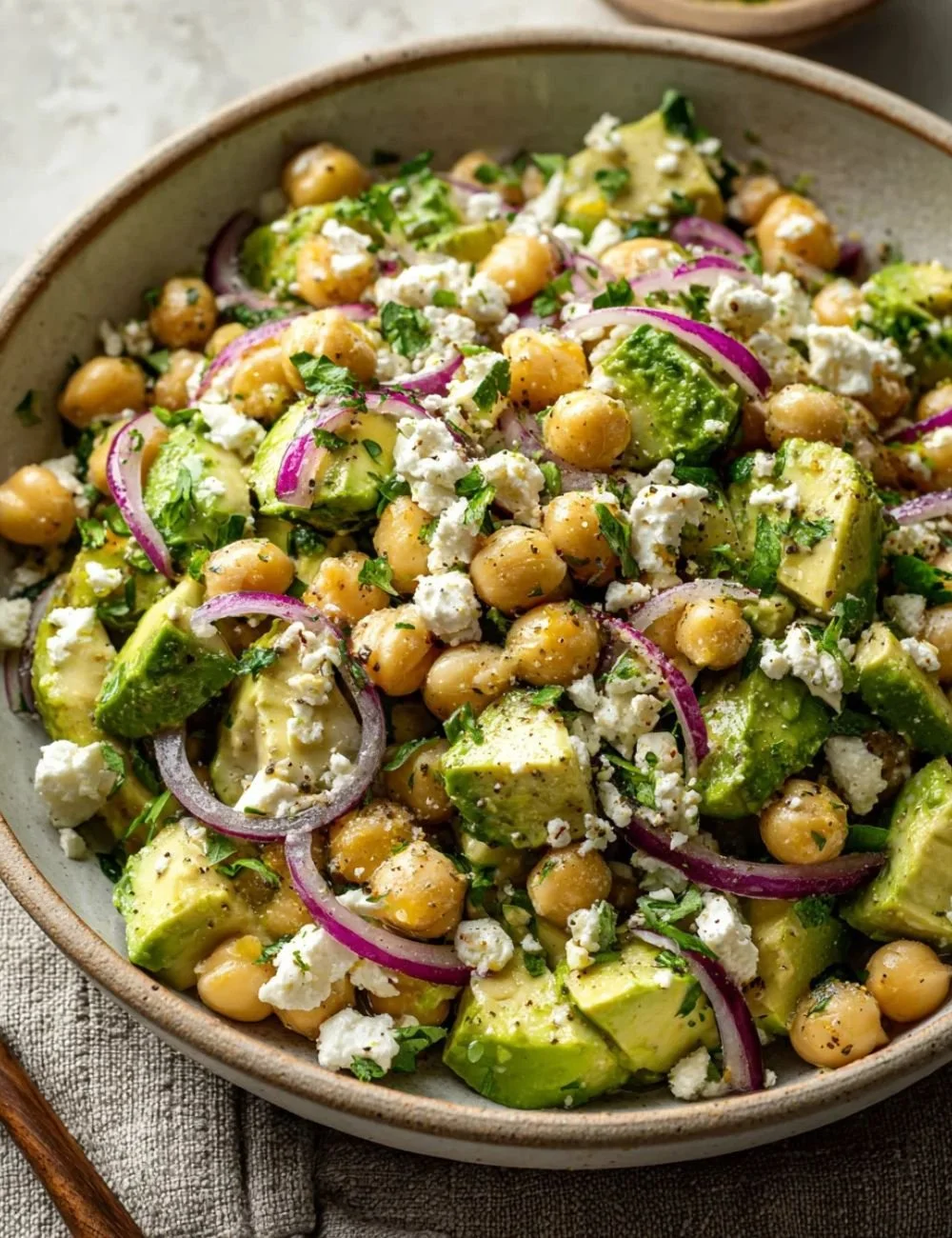 Chickpea Feta Avocado Salad with fresh vegetables in a bowl