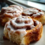 Delicious cottage cheese cinnamon rolls, golden brown and drizzled with icing.
