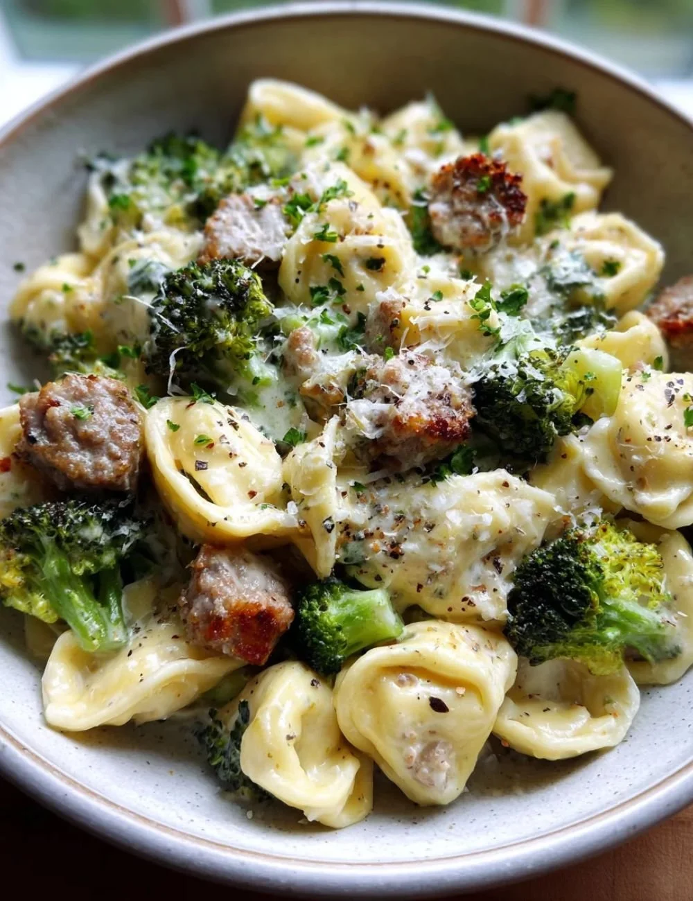 Creamy garlic parmesan tortellini with beef and broccoli dish