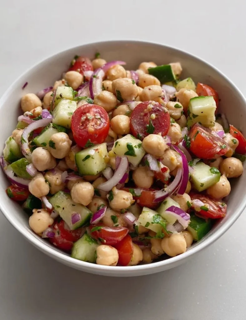 Colorful Mediterranean Bean Salad with fresh vegetables and herbs