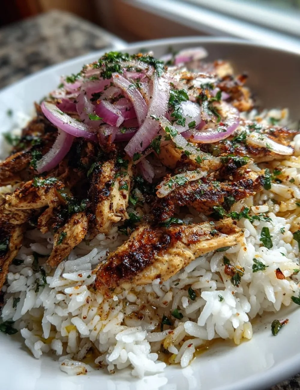 One Pot Chicken Shawarma Rice served in a colorful bowl with spices and herbs.