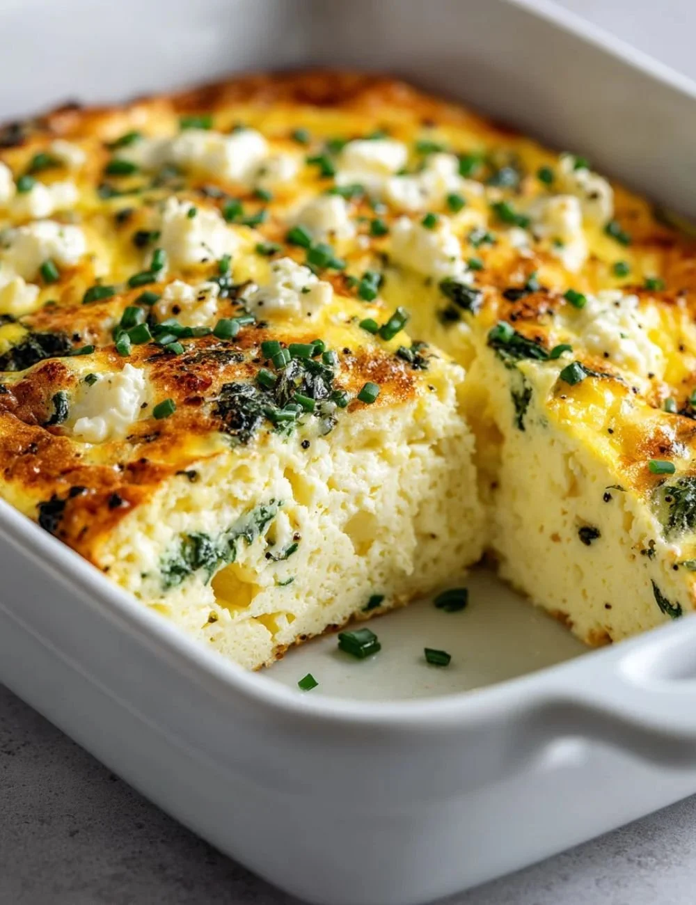 Baked cottage cheese eggs served on a plate with herbs and spices.