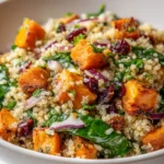 Healthy roasted sweet potato salad with greens and dressing