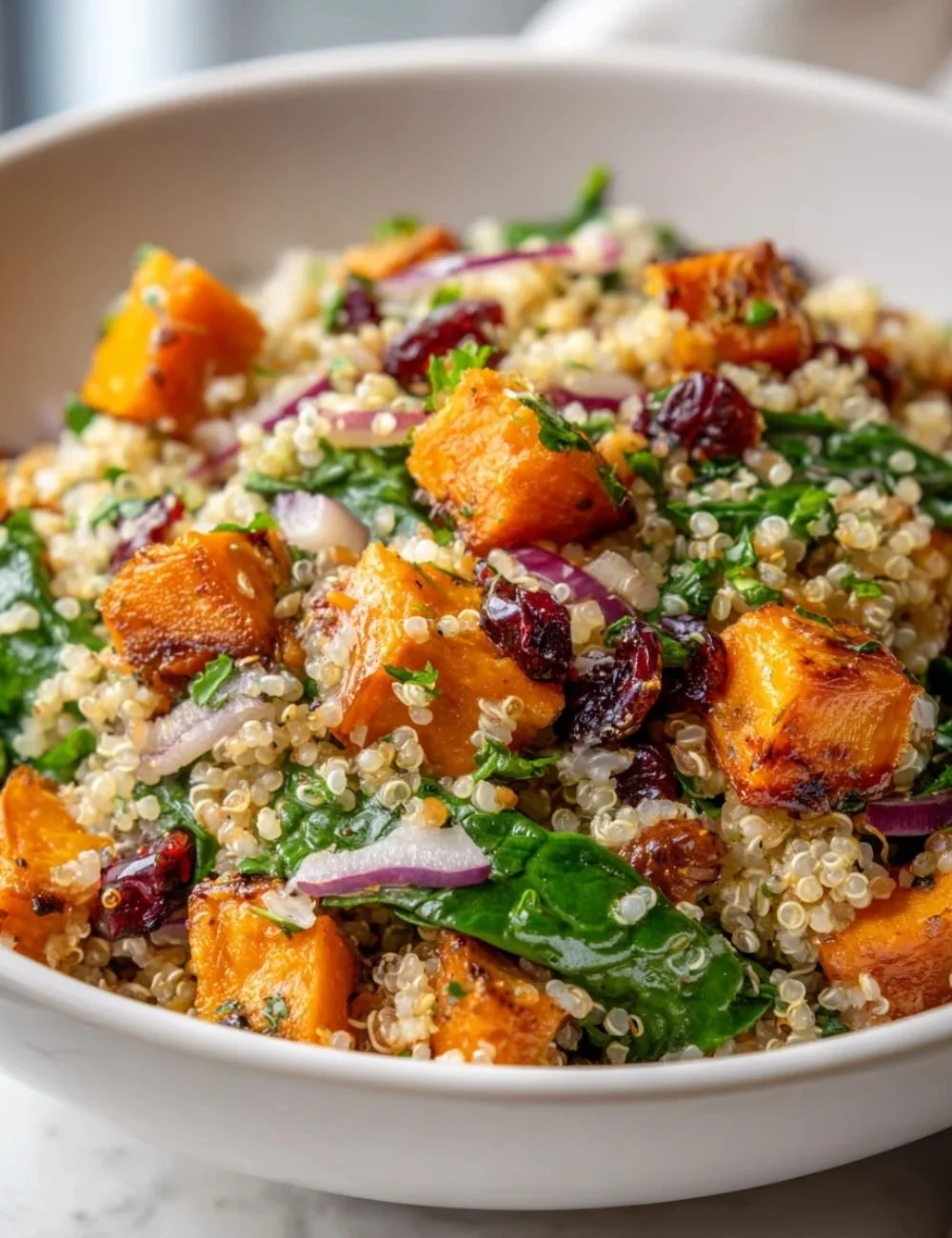 Healthy roasted sweet potato salad with greens and dressing