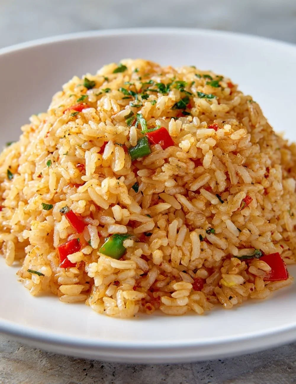 Bowl of Texas Roadhouse seasoned rice garnished with herbs