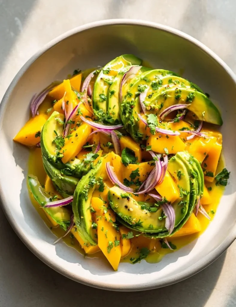 Avocado Mango Salad with Lime Dressing served in a bowl