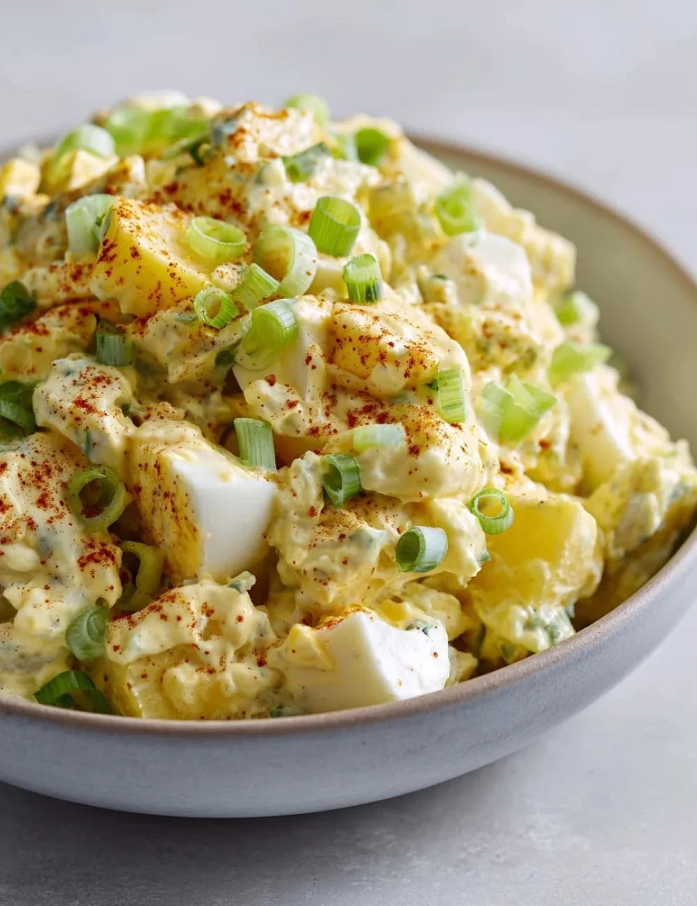 Creamy deviled egg potato salad with herbs and spices