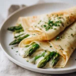 Delicious asparagus crepes filled with cheese and herbs