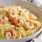 Delicious shrimp garlic butter pasta garnished with fresh herbs