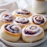 Delicious tangy sourdough blueberry cinnamon rolls fresh out of the oven.