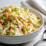 Delicious cabbage ramen noodle salad in a bowl with fresh vegetables