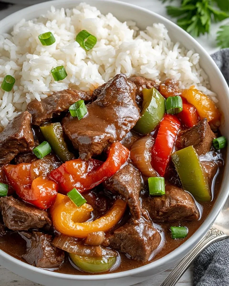 Crock Pot pepper steak with tender beef and colorful bell peppers