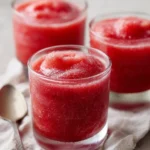 Frozen strawberry daiquiri cocktail with fresh strawberries