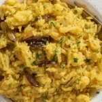 Delicious Golden Onion Butter Rice garnished with fresh herbs.