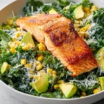 Grilled salmon salad with non-alcoholic ale and parmesan on a plate