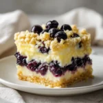 Lemon cream blueberry crumble dessert with fresh blueberries and a crispy topping