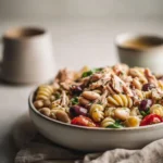 Mediterranean Pasta Salad with Tuna and Beans in a colorful bowl