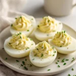 Sour cream and onion deviled eggs served on a platter