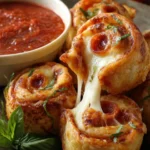 Delicious cheesy pizza roll-ups served on a plate